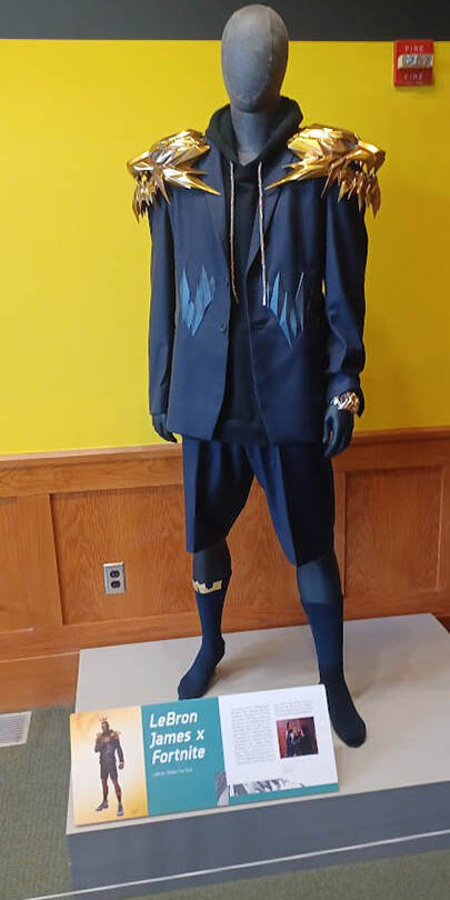 Blue costume with large gold pauldrons