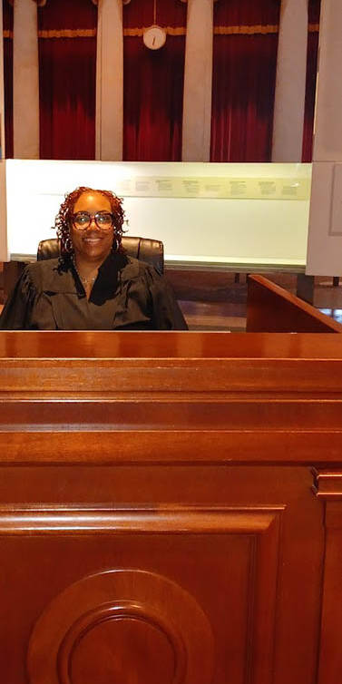 Ta-Tanisha Pierre at a replica Supreme Court Judge bench