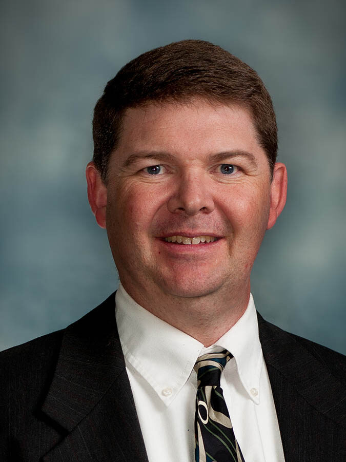 smiling white man in a suit