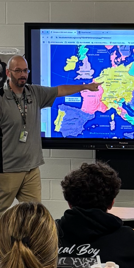 Teacher pointing to a map