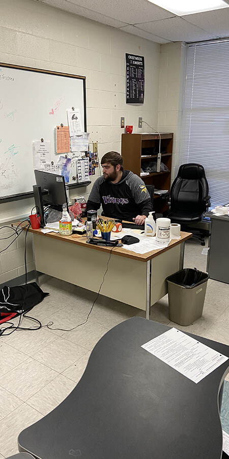 teacher at a desk.