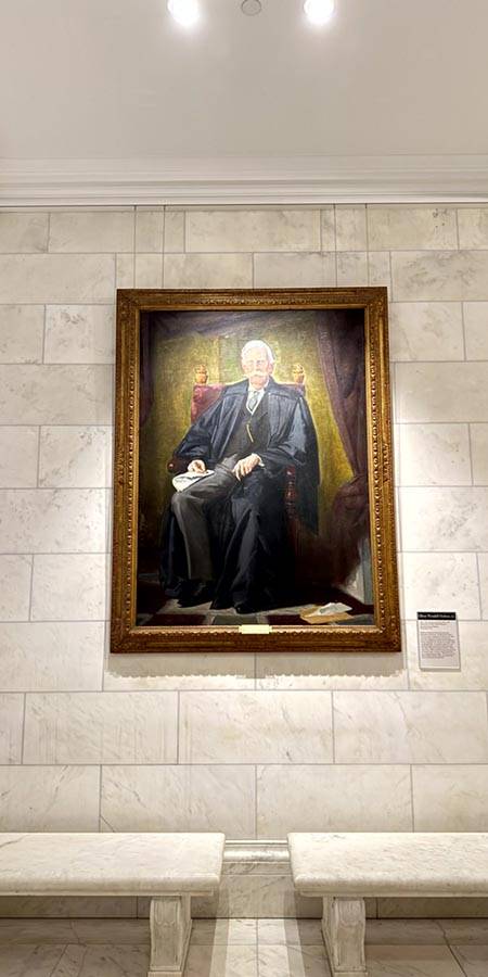 painting of a stern-looking man.