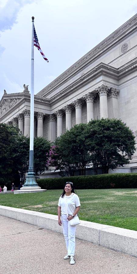Smiling woman outside the national Archives.