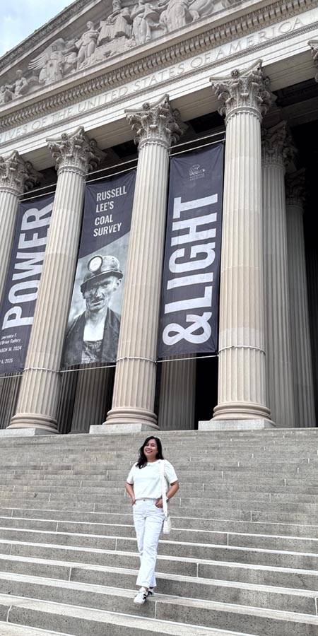 Woman on the steps of the US Achives